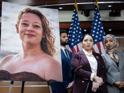 Representatives Maxwell Frost, Delia Ramirez, and Ilhan Omar conduct a news conference on funding and accountability for the Department of Homeland Security alongside an image of Renee Nicole Good on January 13, 2026, in Washington, D.C.