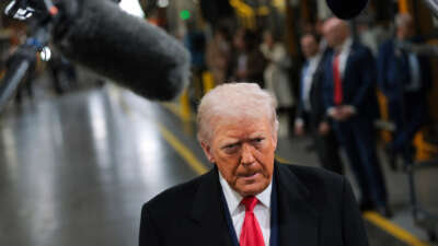 President Donald Trump tours the assembly line at the Ford River Rouge Complex on January 13, 2026, in Dearborn, Michigan.