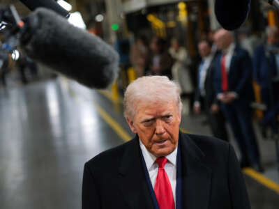 President Donald Trump tours the assembly line at the Ford River Rouge Complex on January 13, 2026, in Dearborn, Michigan.