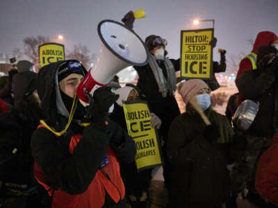 People gather for a noise protest outside a hotel where they believe Immigration and Customs Enforcement agents are staying in Bloomington, Minnesota, on January 16, 2026.