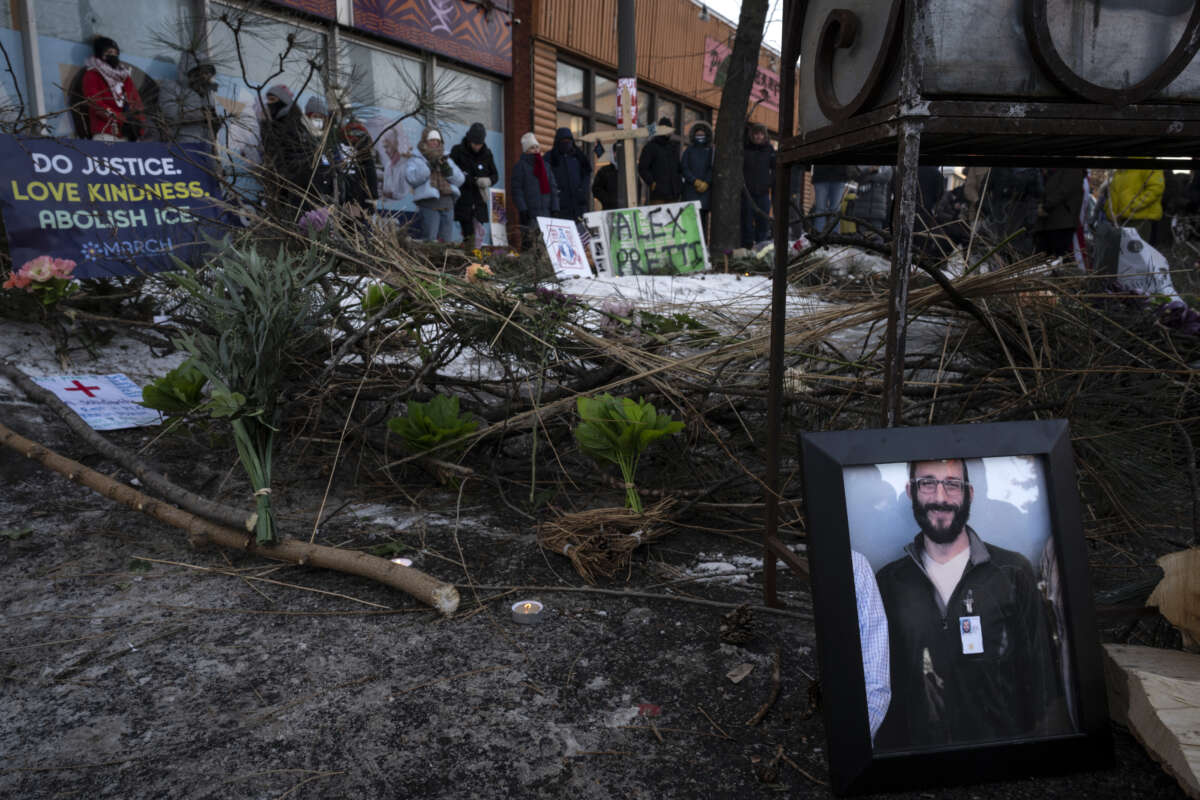 A photograph of 37-year-old Alex Pretti can be seen at a makeshift memorial in the area where he was shot dead by federal immigration agents earlier in the day in Minneapolis, Minnesota, on January 24, 2026.
