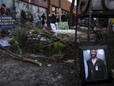 A photograph of 37-year-old Alex Pretti can be seen at a makeshift memorial in the area where he was shot dead by federal immigration agents earlier in the day in Minneapolis, Minnesota, on January 24, 2026.