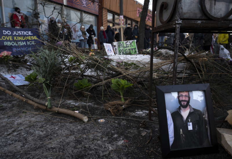 A photograph of 37-year-old Alex Pretti can be seen at a makeshift memorial in the area where he was shot dead by federal immigration agents earlier in the day in Minneapolis, Minnesota, on January 24, 2026.