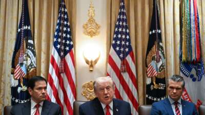 President Donald Trump speaks alongside Secretary of State Marco Rubio (L) and Defense Secretary Pete Hegseth (R) during a cabinet meeting in the Cabinet Room of the White House in Washington, D.C., on January 29, 2026.
