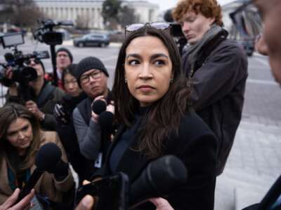 Rep. Alexandria Ocasio-Cortez (D-New York) talks with reporters outside the U.S. Capitol on Friday, January 9, 2026.