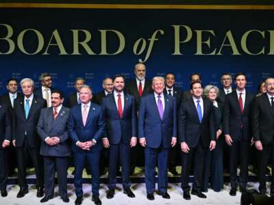 US President Donald Trump (C), flanked by US Vice President JD Vance (L) and US Secretary of State Marco Rubio (R), joins leaders for a group photo during the inaugural meeting of the "Board of Peace" at the US Institute of Peace in Washington, D.C., on February 19, 2026.