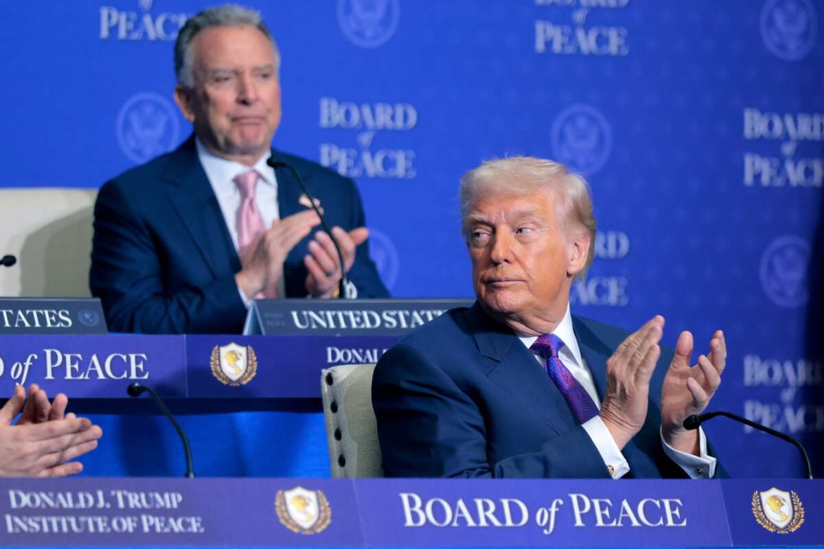 U.S. President Donald Trump (R) and Special Envoy to the Middle East Steve Witkoff clap during the inaugural meeting of the Board of Peace at the Donald J. Trump Institute of Peace on February 19, 2026 in Washington, D.C.