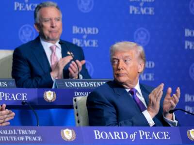 U.S. President Donald Trump (R) and Special Envoy to the Middle East Steve Witkoff clap during the inaugural meeting of the Board of Peace at the Donald J. Trump Institute of Peace on February 19, 2026 in Washington, D.C.
