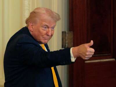 President Donald Trump gestures as he departs a Black History Month reception in the East Room of the White House on February 18, 2026 in Washington, D.C.