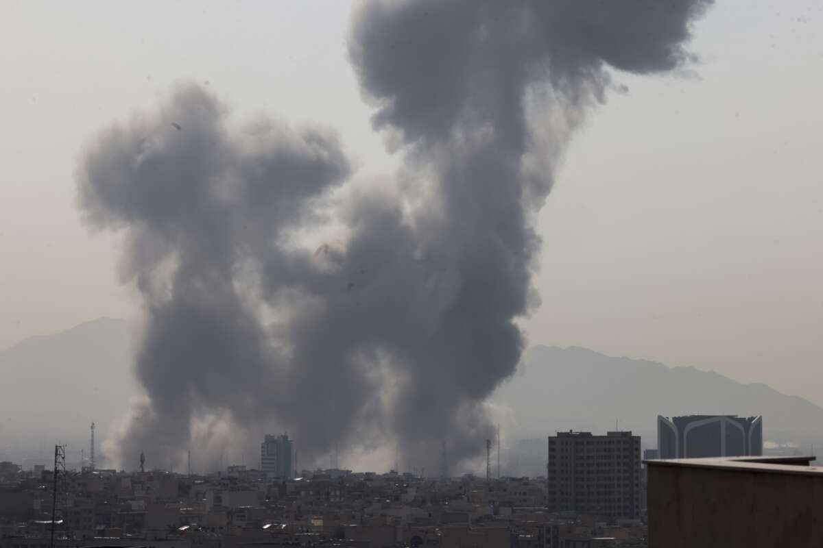 A plume of smoke rises following a reported explosion in Tehran, Iran, on February 28, 2026.