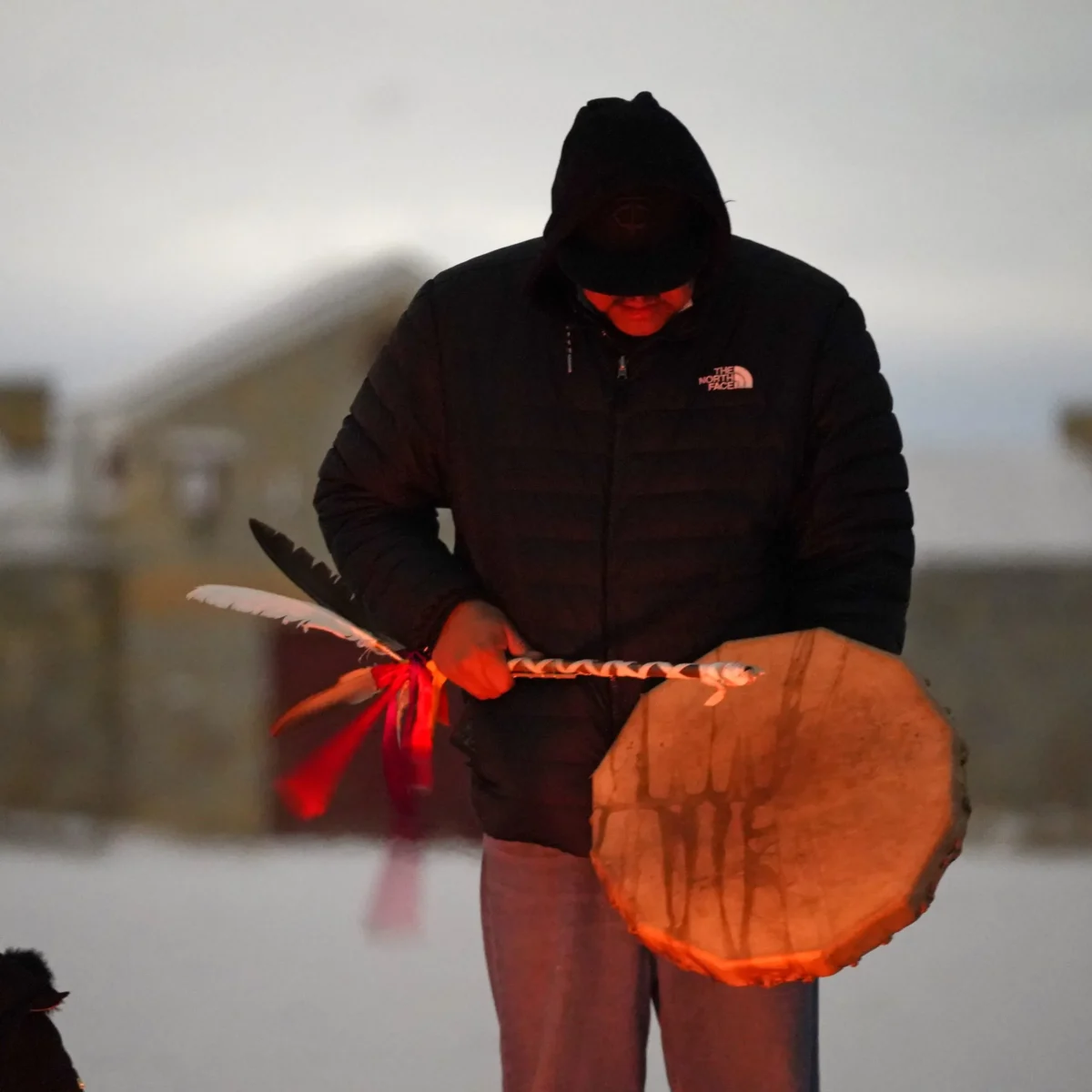 A man sings and plays a drum before the recreation of the historic Fort Snelling in Fort Snelling, Minneapolis. Native activists are seeking to get the state of Minnesota to give the fort to them.