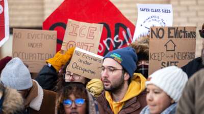 Members of the Minneapolis Federation of Educators and their allies protest the state government’s inaction on housing instability during Operation Metro Surge.