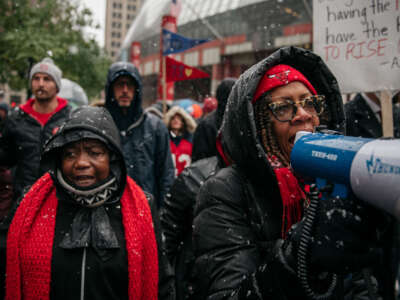Braving snow and cold temperatures, thousands marched through the streets near City Hall during the 11th day of a teachers strike on October 31, 2019, in Chicago, Illinois.