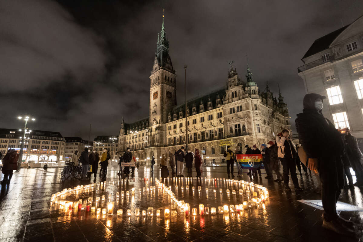 Members of the peace organization International Campaign to Abolish Nuclear Weapons demonstrate with a light action on the first anniversary of the entry into force of the Treaty on the Prohibition of Nuclear Weapons on January 22, 2022, in Hamburg, Germany.