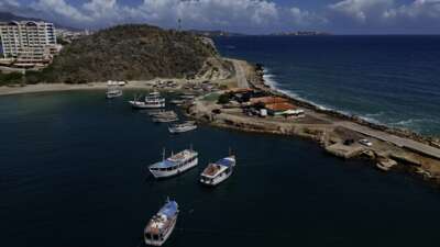 Aerial view of Pier Juan Griego in Margarita Island, Nueva Esparta State, Venezuela, on November 25, 2024. A blockchain-based residential settlement called CryptoCity spans 35 hectares on Margarita Island and is promoted to German and other foreign investors as a highly exclusive enclave.