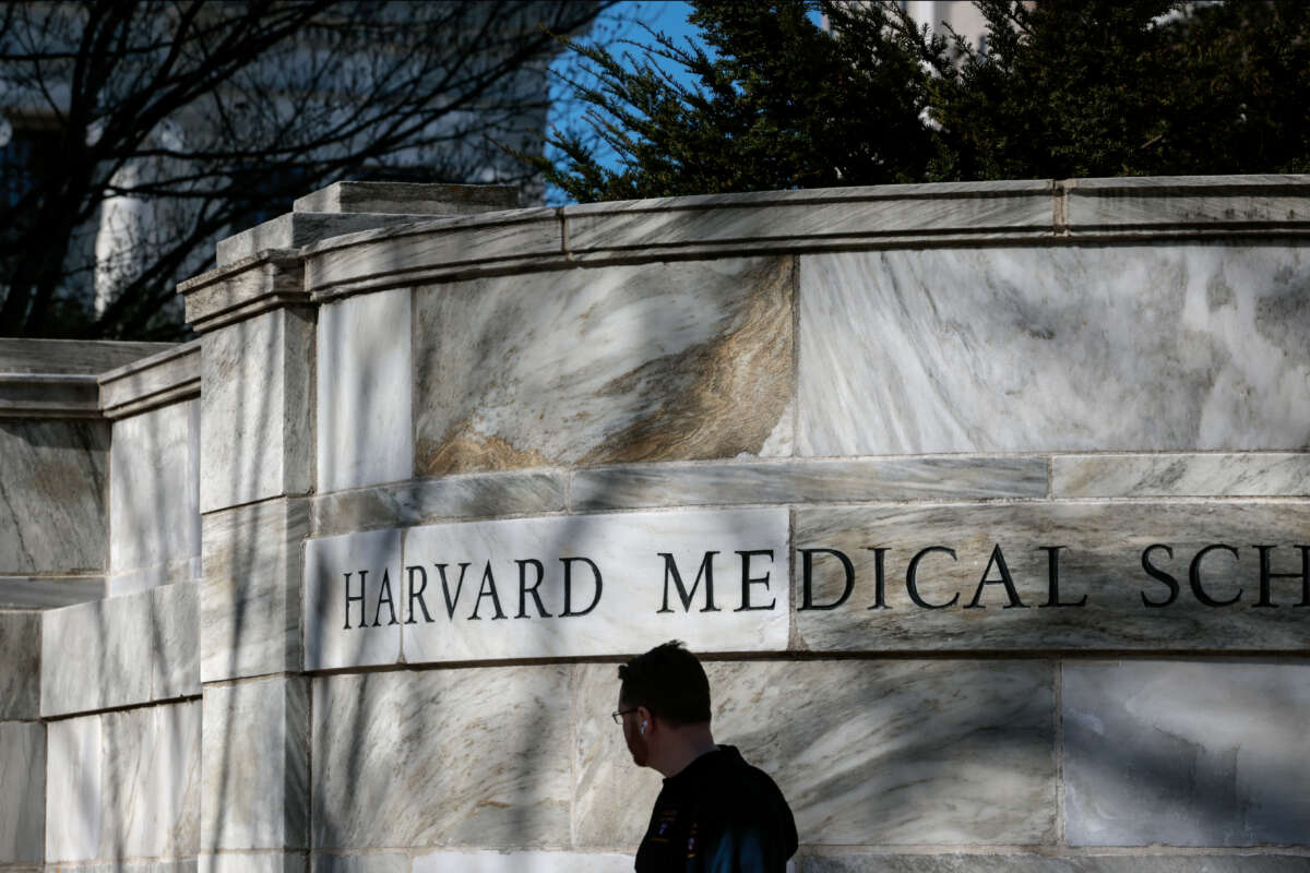 A pedestrian passes Harvard Medical School in Boston, Massachusetts, on April 17, 2025.