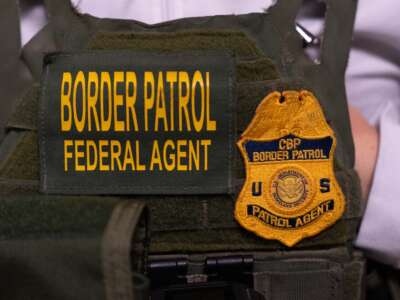 A U.S. Customs and Border Patrol agent stands outside of immigration court hearings, at Jacob K. Javits Federal Building on June 10, 2025, in New York City.
