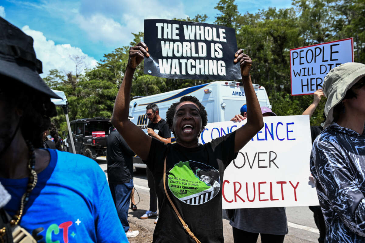 Protesters gather to demand the closure of the immigrant detention center known as "Alligator Alcatraz" at the Dade-Collier Training and Transition Airport in Ochopee, Florida, on July 22, 2025.