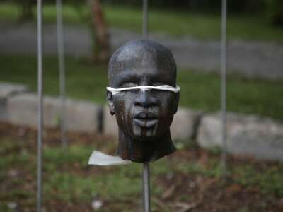 A sculpture by artist Woodrow Nash on display at the Whitney Plantation, depicting severed heads mounted on poles, pays tribute to the 1811 German Coast Uprising: the largest slave uprising in the American South. The Whitney Plantation, a museum situated approximately 45 miles from New Orleans, Louisiana, is the first plantation museum in Louisiana to focus exclusively on the lives of enslaved people.