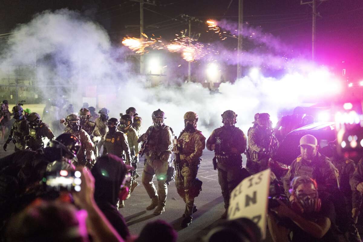 Federal agents attack demonstrators protesting outside of an immigrant processing center with a barrage of tear gas and pepper balls on September 27, 2025, in Broadview, Illinois. The demonstrators were protesting a recent surge in ICE apprehensions in the Chicago area, part of a push by the Trump administration, dubbed “Operation Midway Blitz.”