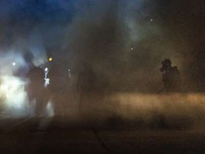 Federal agents attack demonstrators protesting outside of an immigrant jail with a barrage of tear gas and pepper balls on September 27, 2025, in Broadview, Illinois.