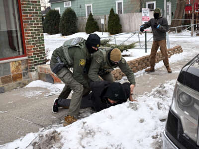 U.S. Border Patrol agents carry out an arrest on January 11, 2026 in Minneapolis, Minnesota.