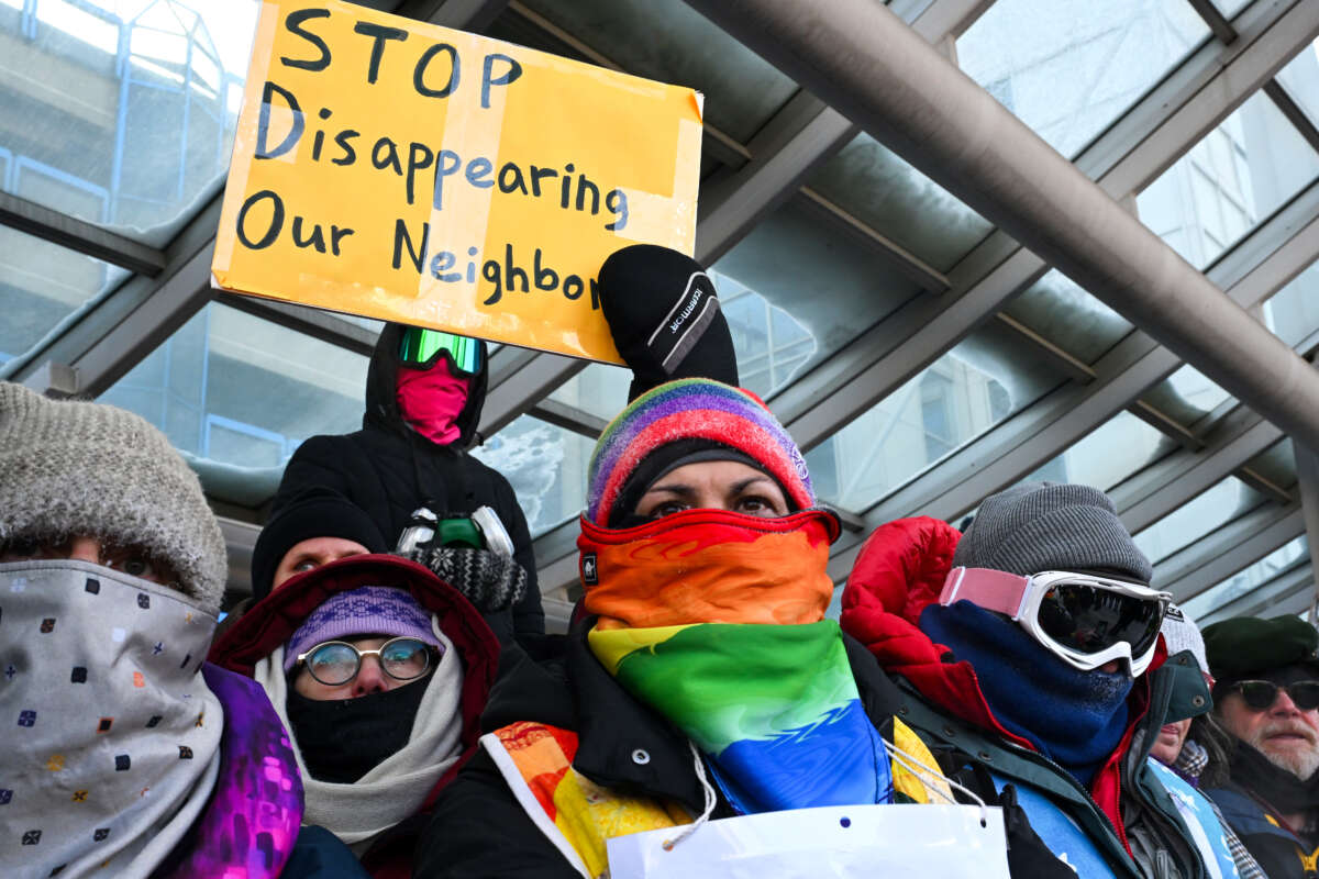 People attend a demonstration at the Minneapolis-Saint Paul International airport amid a surge of federal immigration authorities in the area in St. Paul, Minnesota, on January 23, 2026.