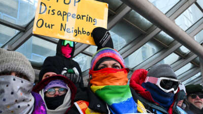 People attend a demonstration at the Minneapolis-Saint Paul International airport amid a surge of federal immigration authorities in the area in St. Paul, Minnesota, on January 23, 2026.