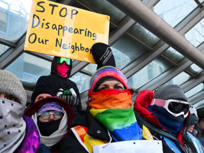 People attend a demonstration at the Minneapolis-Saint Paul International airport amid a surge of federal immigration authorities in the area in St. Paul, Minnesota, on January 23, 2026.