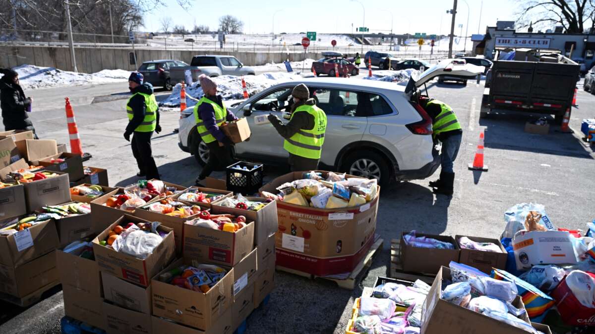 People prepare food packages for immigrants at the Dios Habla Hoy church in Minneapolis, Minnesota, in January 2026.
