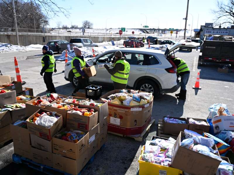 People prepare food packages for immigrants at the Dios Habla Hoy church in Minneapolis, Minnesota, in January 2026.