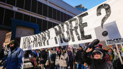 Protesters carry a large banner during a march against Immigration and Customs Enforcement (ICE) in Minneapolis, Minnesota, on January 30, 2026.