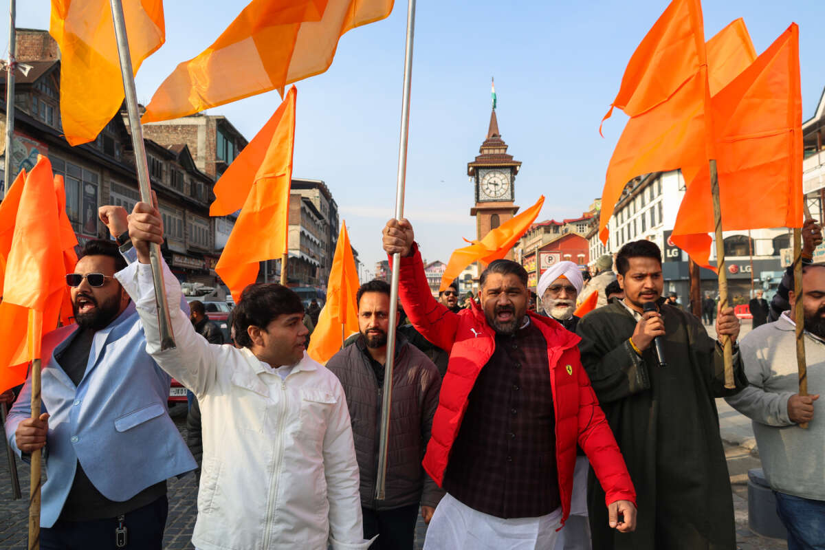 Leaders and members of the Rashtriya Swayamsevak Sangh (RSS) carry the party flags during a Dhwaj Yatra (flag rally) to mark its 100 years near the clock tower (Ghanta Ghar) in Srinagar, Jammu and Kashmir, on February 6, 2026.