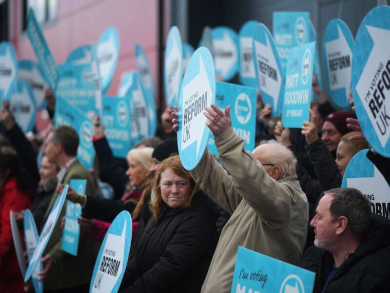 Reform U.K. supporters are seen as they open their campaign headquarters on February 5, 2026, in Denton, England.