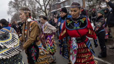 American Indian Movement dancers dance at the site where Renee Nicole Good was shot and killed by a Federal agent, on February 1, 2026, on Portland Avenue in Minneapolis, Minnesota.