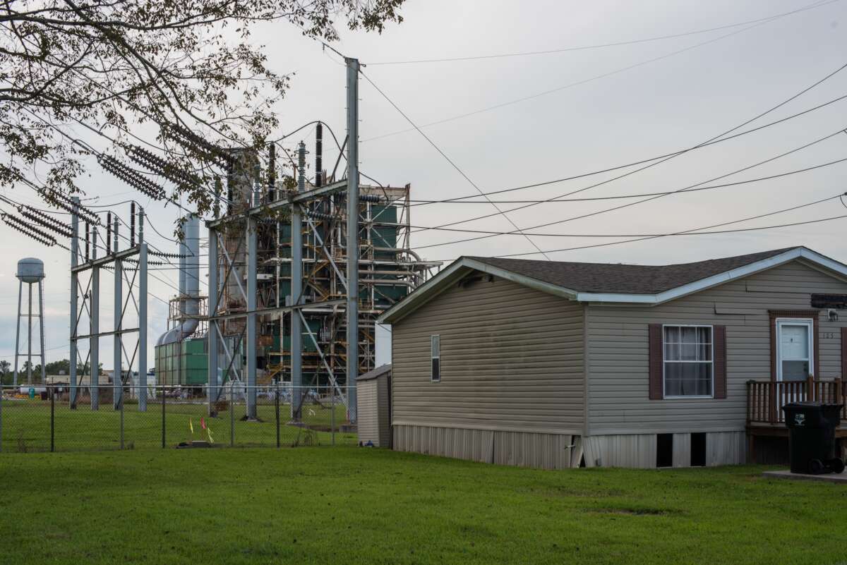 A house sits along the long stretch of River Road by the Mississippi River and the many chemical plants in Baton Rouge, Louisiana, on October 12, 2013. “Cancer Alley” stretches from New Orleans to Baton Rouge, where a dense concentration of oil refineries, petrochemical plants, and other chemical industries reside alongside suburban homes.