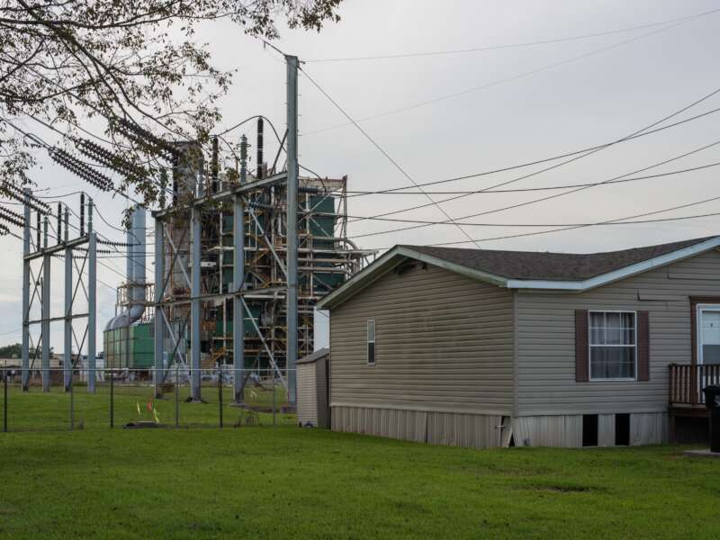 A house sits along the long stretch of River Road by the Mississippi River and the many chemical plants in Baton Rouge, Louisiana, on October 12, 2013. “Cancer Alley” stretches from New Orleans to Baton Rouge, where a dense concentration of oil refineries, petrochemical plants, and other chemical industries reside alongside suburban homes.