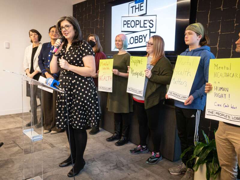 Members of The People's Lobby celebrate the passage of House Bill 1085 in Illinois on February 9, 2026.