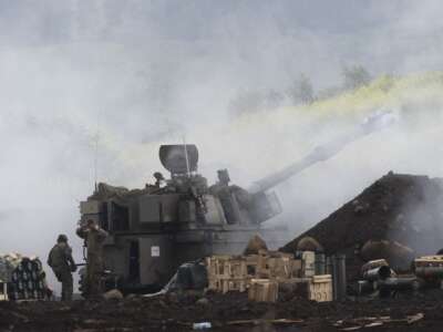 An Israeli artillery unit fires towards southern Lebanon as seen from a position on the Israeli side of the border on March 15, 2026.