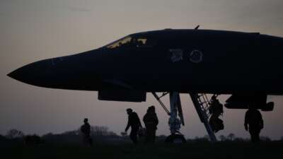 Flight crew board U.S. Air Force B-1B Lancer bombers as they prepare for take off at RAF Fairford, which the U.S. is using in relation to the war on Iran, on March 13, 2026 in Fairford, England.