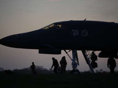 Flight crew board U.S. Air Force B-1B Lancer bombers as they prepare for take off at RAF Fairford, which the U.S. is using in relation to the war on Iran, on March 13, 2026 in Fairford, England.