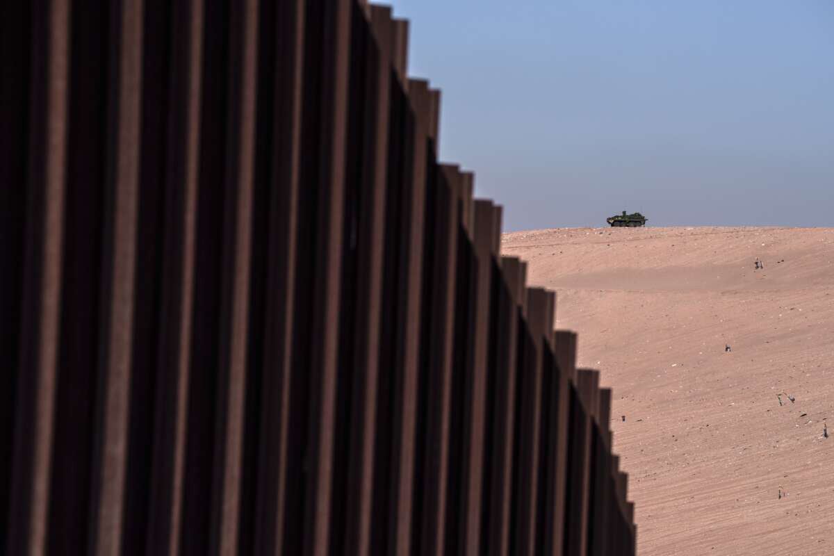 A Stryker armored infantry transport vehicle, used by the U.S. Army, and deployed along the U.S.-Mexico border as part of the military's Joint Task Force Southern Border mission, is perched atop a border hill in Sunland Park, New Mexico, on April 4, 2025.