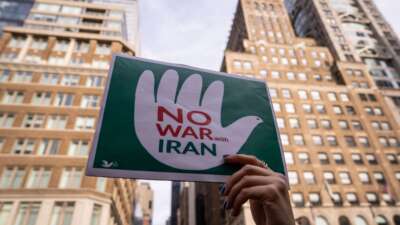 People attend a rally calling for the Trump administration not to go to war with Iran, on June 18, 2025, in New York City.