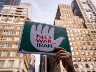 People attend a rally calling for the Trump administration not to go to war with Iran, on June 18, 2025, in New York City.