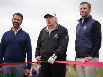 Donald Trump (center), Donald Trump Jr. (left) and Eric Trump (right) attend a ribbon-cutting ceremony at a new 18-hole course at Trump International Golf Links on July 29, 2025, in Balmedie, near Aberdeen, Scotland.