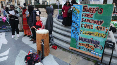 Homeless advocates attend a sweeps-free sanctuary protest outside of City Hall in Oakland, California, on December 17, 2024.