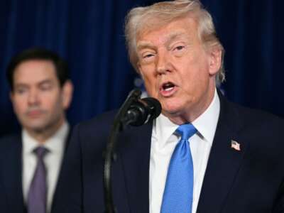 President Donald Trump speaks to the press as Secretary of State Marco Rubio looks on following U.S. military actions in Venezuela, at his Mar-a-Lago residence in Palm Beach, Florida, on January 3, 2026.
