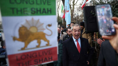 Reform UK leader Nigel Farage visits anti-Iranian government protesters during a gathering outside the Iranian Embassy in central London, on January 12, 2026.