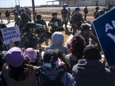 Texas State Troopers push protestors and deploy pepper balls during a protest against Immigration and Customs Enforcement outside the South Texas Family Residential Center on January 28, 2026, in Dilley, Texas.