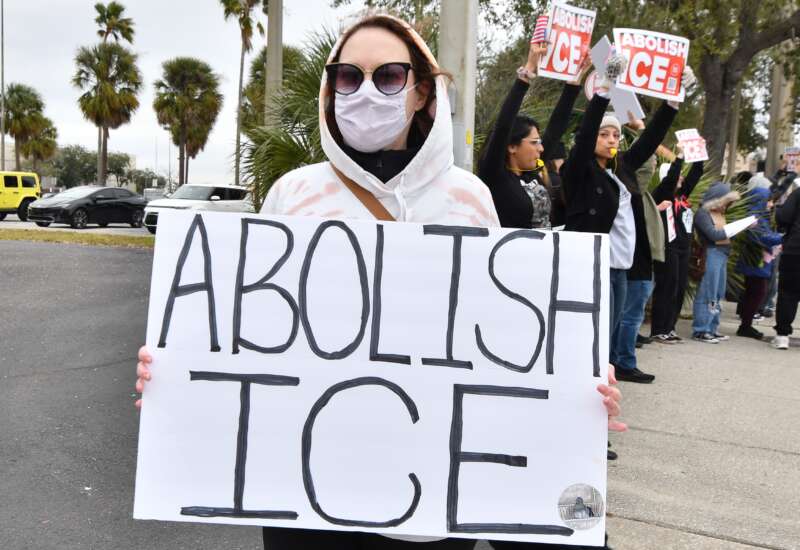 Protesters take to the streets in Orlando, Florida, on January 31, 2026, to demonstrate against the actions of ICE, chanting slogans and carrying signs.